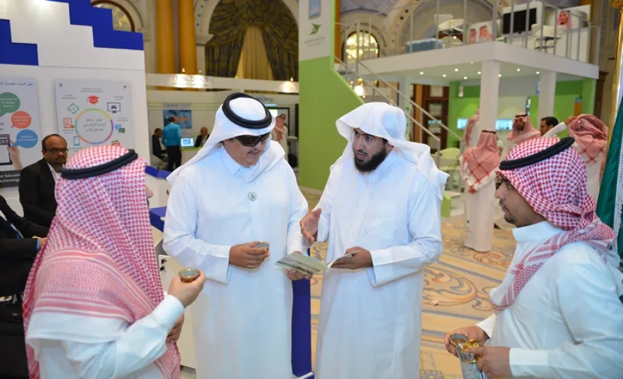 The Deanship of e-learning booth at the accompanying Exhibition for the Fourth International Conference receives a number of officials in the Ministry of Education - 