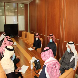 The dean in a meeting with students