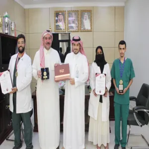 Dean of the College honors winning team of the Laboratory Department