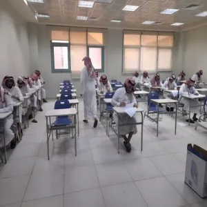 The Dean of the College of Education inspects the progress of final exams for master's programs.