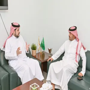 The Media Center's director meets the dean of the College of Applied Medical Science