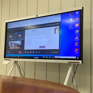 The University Vice President for Educational Affairs holds a working session to review a visual presentation on educational projects