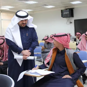 The CEO of the Applied College on a tour of inspection to final exams classrooms