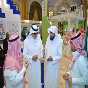 The Deanship of e-learning booth at the accompanying Exhibition for the Fourth International Conference receives a number of officials in the Ministry of Education