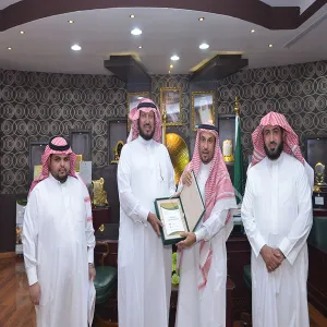 THE RECTOR RECEIVES A COPY OF THE E-UNIVERSITY TRANSPORT SYSTEM DIRECTORY
